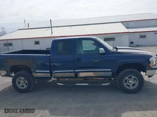 1999 Chevrolet Silverado 1500 LT with VIN 1GCEK19T3XE123498, listed as a IAAI auction lot 41801019 with 213,646 mi miles. Bid and sale history available at carsss.com. Image 14.