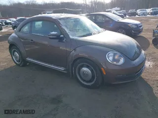 2012 Volkswagen Beetle 2.5L PZEV with VIN 3VWJP7AT9CM609099, listed as a IAAI auction lot 41396554 with 151,393 mi miles. Bid and sale history available at carsss.com. Image 1.