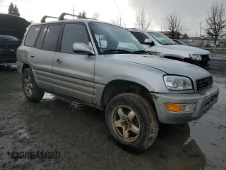 2000 Toyota RAV4 with VIN JT3HP10V7Y7169097, listed as a Copart auction lot 43357225 with 295,509 mi miles and Salvage title. Bid and sale history available at DreamBid. Image 4.