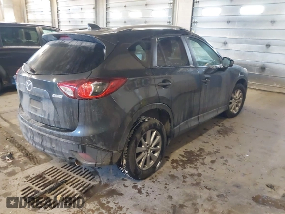 2015 Mazda CX-5 Touring with VIN JM3KE2CY2F0458114, listed as a IAAI auction lot 41545493 with 138,061 mi miles. Bid and sale history available at carsss.com. Image 4.