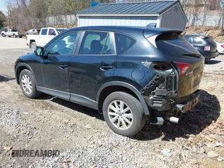 2014 Mazda CX-5 Touring with VIN JM3KE4CY8E0333029, listed as a IAAI auction lot 41857199 with 218,887 mi miles. Bid and sale history available at carsss.com. Image 3.