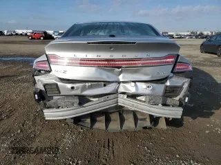 2014 Lincoln MKZ with VIN 3LN6L2JKXER806539, listed as a Copart auction lot 42724215 with 104,283 mi miles and Salvage title. Bid and sale history available at DreamBid. Image 6.
