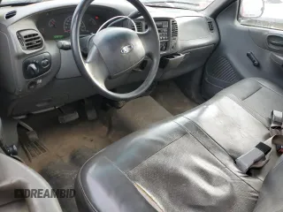 2001 Ford F-150 XL z VIN 3FTZF17291MA72686, wystawiony jako Copart lot #83103904 z przebiegiem 126 018 mil mil oraz Szkoda całkowita • Salvage title. Historia ofert i sprzedaży dostępna na DreamBid. Obrazek 8.