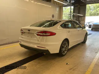 2020 Ford Fusion SEL z VIN 3FA6P0CD4LR177021, wystawiony jako IAAI lot #42743422 z przebiegiem 81 131 mil mil oraz . Historia ofert i sprzedaży dostępna na DreamBid. Obrazek 12.