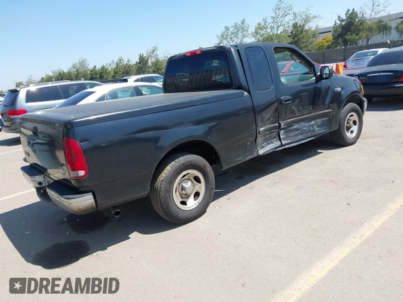 2003 Ford F-150 XL with VIN 1FTRX17213NB70553, listed as a IAAI auction lot 41946968 with 186,683 mi miles. Bid and sale history available at carsss.com. Image 4.