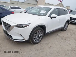 2023 Mazda CX-9 Grand Touring с VIN JM3TCBDY0P0634099, выставлен на аукционе IAAI как лот 41943704 с пробегом 5 615 миль миль и . История ставок и продаж доступна на DreamBid. Изображение 2.