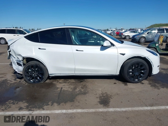 2023 Tesla Model Y Long Range with VIN 7SAYGDEE0PF945202, listed as a IAAI auction lot 41611762 with 7,316 mi miles and . Bid and sale history available at DreamBid. Image 13.