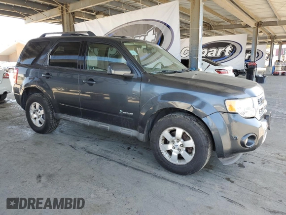 2010 Ford Escape Hybrid z VIN 1FMCU5K30AKA77460, wystawiony jako Copart lot #56363305 z przebiegiem 294 973 mil mil oraz Czysty tytuł • Clean title. Historia ofert i sprzedaży dostępna na DreamBid. Obrazek 4.