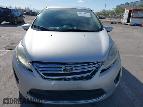 2012 Ford Fiesta SE with VIN 3FADP4BJ2CM150953, listed as a IAAI auction lot 42010904 with 77,637 mi miles. Bid and sale history available at carsss.com. Image 12.