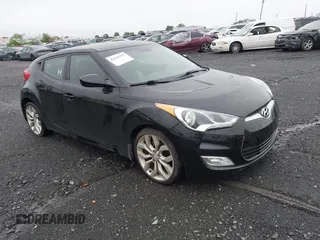 2012 Hyundai Veloster w/Gray Int z VIN KMHTC6AD0CU080630, wystawiony jako IAAI lot #42191015 z przebiegiem 48 405 mil mil oraz . Historia ofert i sprzedaży dostępna na DreamBid. Obrazek 1.