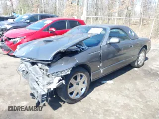 2003 Ford Thunderbird Deluxe with VIN 1FAHP60A23Y101899, listed as a IAAI auction lot 41805269 with Not Provided miles. Bid and sale history available at carsss.com. Image 2.