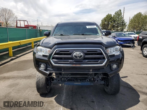 2019 Toyota Tacoma SR z VIN 3TMCZ5AN1KM253032, wystawiony jako Copart lot #52598445 z przebiegiem 69 489 mil mil oraz Szkoda całkowita • Salvage title. Historia ofert i sprzedaży dostępna na DreamBid. Obrazek 5.