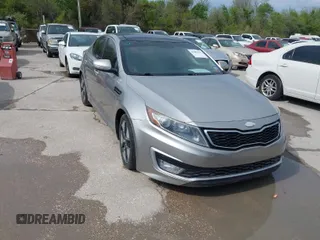 2013 Kia Optima Hybrid EX with VIN KNAGM4ADXD5039535, listed as a IAAI auction lot 41886125 with 143,540 mi miles. Bid and sale history available at carsss.com. Image 1.