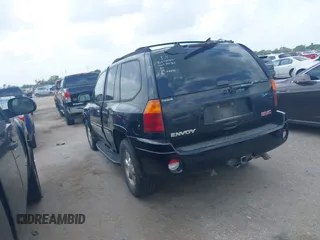 2004 GMC Envoy SLE with VIN 1GKDS13SX42398363, listed as a IAAI auction lot 42154134 with 308,001 mi miles and . Bid and sale history available at DreamBid. Image 3.