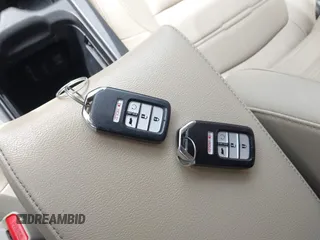 2018 Honda CR-V EX-L z VIN 5J6RW2H89JL011696, wystawiony jako IAAI lot #42521401 z przebiegiem Nie podano mil oraz . Historia ofert i sprzedaży dostępna na DreamBid. Obrazek 11.