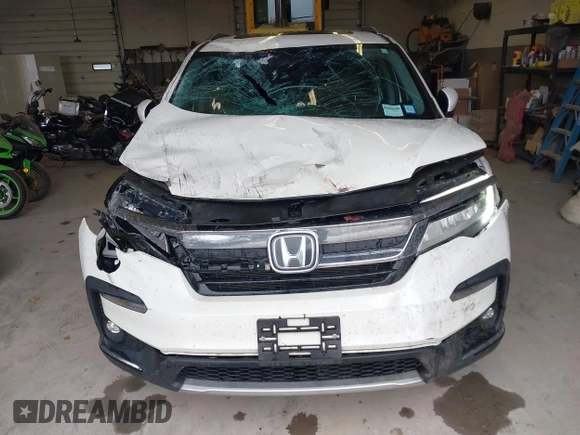 2019 Honda Pilot Elite with VIN 5FNYF6H08KB054725, listed as a IAAI auction lot 40496860 with 91,284 mi miles and . Bid and sale history available at DreamBid. Image 6.