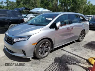 2023 Honda Odyssey Elite with VIN 5FNRL6H99PB004323, listed as a Copart auction lot 58869455 with 57,611 mi miles and Salvage title. Bid and sale history available at DreamBid. Image 1.