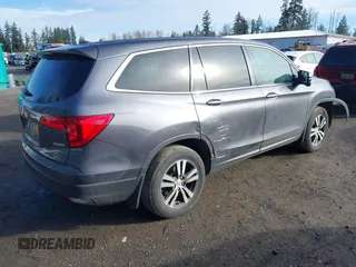 2017 Honda Pilot EX-L with VIN 5FNYF6H5XHB059834, listed as a IAAI auction lot 41670003 with 58,285 mi miles and . Bid and sale history available at DreamBid. Image 4.