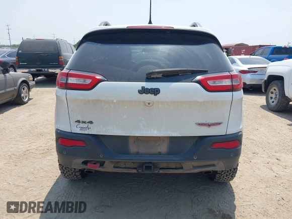 2015 Jeep Cherokee Trailhawk z VIN 1C4PJMBS5FW574102, wystawiony jako IAAI lot #42278805 z przebiegiem 164 250 mil mil oraz . Historia ofert i sprzedaży dostępna na DreamBid. Obrazek 17.