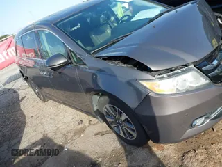 2015 Honda Odyssey Touring Elite with VIN 5FNRL5H90FB097984, listed as a IAAI auction lot 41822726 with 107,322 mi miles and . Bid and sale history available at DreamBid. Image 1.