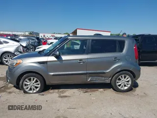 2012 Kia Soul + with VIN KNDJT2A69C7386679, listed as a IAAI auction lot 41969598 with 319,595 mi miles. Bid and sale history available at carsss.com. Image 14.