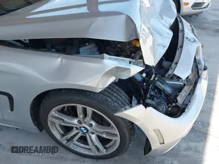 2015 BMW 4 Series 428i with VIN WBA4A5C58FD410076, listed as a IAAI auction lot 39384271 with 125,987 mi miles and . Bid and sale history available at DreamBid. Image 12.