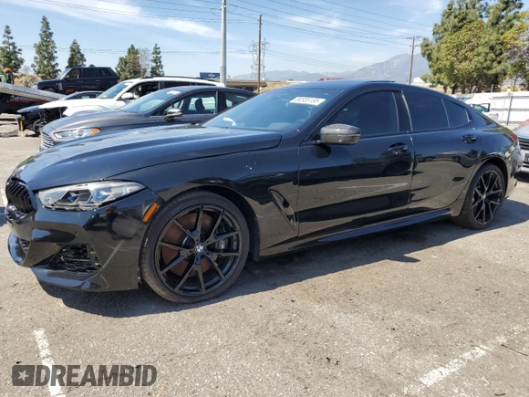 2022 BMW 8 Series M850i with VIN WBAGV8C02NCK08667, listed as a Copart auction lot 50335155 with 22,737 mi miles and Salvage title. Bid and sale history available at DreamBid. Image 1.