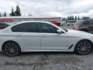 2019 BMW 5 Series 530e with VIN WBAJA9C57KB389401, listed as a IAAI auction lot 42565098 with 52,343 mi miles and . Bid and sale history available at DreamBid. Image 14.