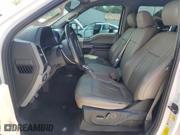 2018 Ford F-150 XL with VIN 1FTEW1EP0JFA28850, listed as a Copart auction lot 63585615 with 210,626 mi miles and Salvage title. Bid and sale history available at DreamBid. Image 7.