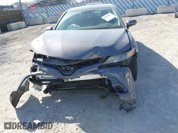 2019 Toyota Camry LE with VIN 4T1B11HK9KU810347, listed as a IAAI auction lot 41804007 with 75,063 mi miles and . Bid and sale history available at DreamBid. Image 6.