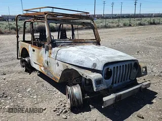 2000 Jeep Wrangler SE with VIN 1J4FA29P2YP797531, listed as a Copart auction lot 56058845 with Not provided miles and Salvage title. Bid and sale history available at DreamBid. Image 12.