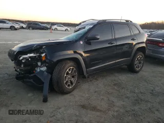 2020 Jeep Cherokee Trailhawk z VIN 1C4PJMBNXLD501986, wystawiony jako Copart lot #82625034 z przebiegiem 36 735 mil mil oraz Szkoda całkowita • Salvage title. Historia ofert i sprzedaży dostępna na DreamBid. Obrazek 1.
