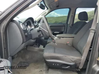 2006 Mitsubishi Raider Duro Cross z VIN 1Z7HC38N86S542959, wystawiony jako Copart lot #57301385 z przebiegiem 149 167 mil mil oraz Tytuł czysty. Historia ofert i sprzedaży dostępna na DreamBid. Obrazek 7.