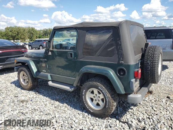 2001 Jeep Wrangler Sahara with VIN 1J4FA59S61P373670, listed as a Copart auction lot 74060614 with 176,111 mi miles and Clean Title. Bid and sale history available at carsss.com. Image 2.