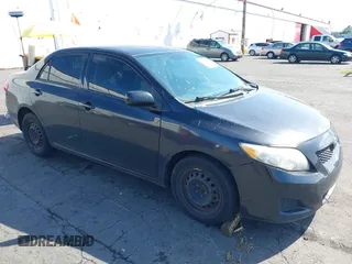 2009 Toyota Corolla with VIN JTDBL40E899046607, listed as a IAAI auction lot 42141452 with 204,769 mi miles. Bid and sale history available at carsss.com. Image 1.