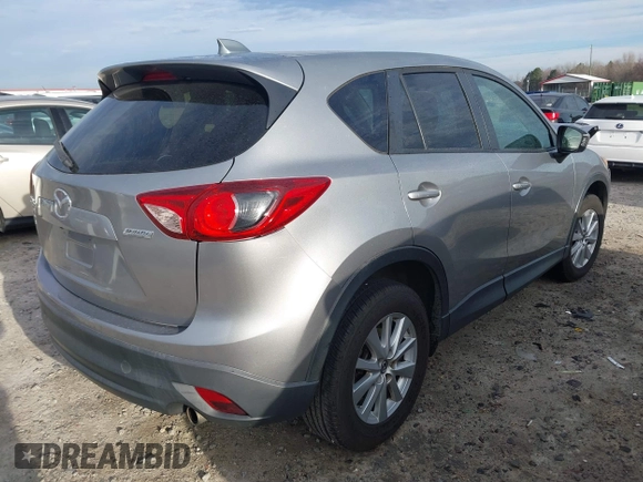 2015 Mazda CX-5 Touring with VIN JM3KE2CYXF0435583, listed as a IAAI auction lot 41737810 with 107,270 mi miles and . Bid and sale history available at DreamBid. Image 4.