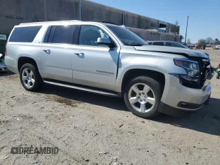 2016 Chevrolet Suburban LT with VIN 1GNSKHKC3GR394311, listed as a Copart auction lot 47304525 with 114,697 mi miles and Salvage Title. Bid and sale history available at DreamBid. Image 4.