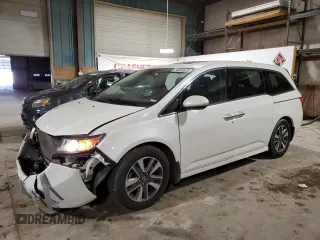 2014 Honda Odyssey Touring with VIN 5FNRL5H90EB137575, listed as a Copart auction lot 54606535 with 168,714 mi miles and Salvage title. Bid and sale history available at DreamBid. Image 1.