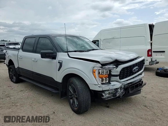 2023 Ford F-150 XL with VIN 1FTFW1E84PKE35275, listed as a Copart auction lot 61867535 with 22,142 mi miles and Salvage title. Bid and sale history available at DreamBid. Image 14.
