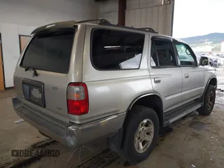 1999 Toyota 4Runner SR5 z VIN JT3HN86R8X0221532, wystawiony jako IAAI lot #41902556 z przebiegiem 406 602 mil mil oraz . Historia ofert i sprzedaży dostępna na DreamBid. Obrazek 4.