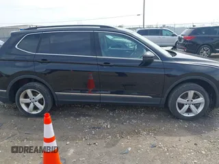 2021 Volkswagen Tiguan SE with VIN 3VV2B7AX4MM050282, listed as a IAAI auction lot 42124808 with 80,082 mi miles and . Bid and sale history available at DreamBid. Image 14.