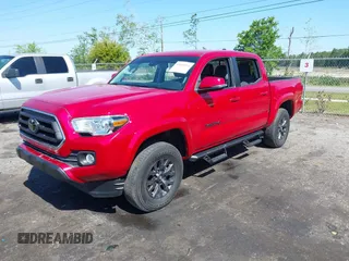 2022 Toyota Tacoma SR with VIN 3TMCZ5AN7NM470900, listed as a IAAI auction lot 42060911 with 38,869 mi miles and . Bid and sale history available at DreamBid. Image 2.