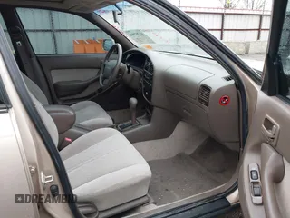 1996 Toyota Camry DX with VIN 4T1BG12K8TU738565, listed as a IAAI auction lot 41702096 with 100,587 mi miles. Bid and sale history available at carsss.com. Image 5.