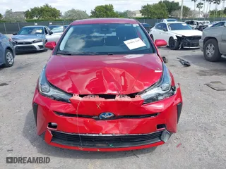 2021 Toyota Prius L Eco with VIN JTDKAMFU6M3148195, listed as a IAAI auction lot 41801369 with 130,601 mi miles. Bid and sale history available at carsss.com. Image 13.