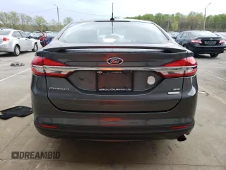 2018 Ford Fusion SE z VIN 3FA6P0HD8JR245391, wystawiony jako Copart lot #53571445 z przebiegiem 158 138 mil mil oraz Czysty tytuł • Clean title. Historia ofert i sprzedaży dostępna na DreamBid. Obrazek 6.