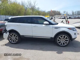 2015 Land Rover Range Rover Evoque Prestige z VIN SALVV2BG4FH076675, wystawiony jako IAAI lot #42138353 z przebiegiem 99 751 mil mil oraz . Historia ofert i sprzedaży dostępna na DreamBid. Obrazek 13.