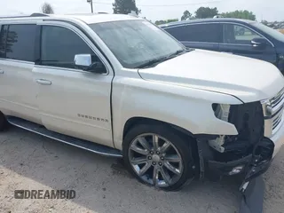 2015 Chevrolet Suburban LTZ with VIN 1GNSCKKC5FR740352, listed as a IAAI auction lot 39075234 with 112,945 mi miles and . Bid and sale history available at DreamBid. Image 6.