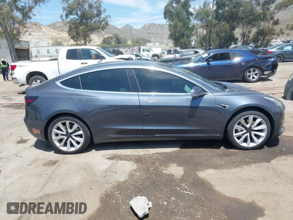 2020 Tesla Model 3 Standard Range Plus with VIN 5YJ3E1EAXLF615781, listed as a IAAI auction lot 42068935 with 96,026 mi miles. Bid and sale history available at carsss.com. Image 13.