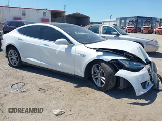 2013 Tesla Model S with VIN 5YJSA1CN2DFP26615, listed as a IAAI auction lot 42056333 with 71,892 mi miles and . Bid and sale history available at DreamBid. Image 1.