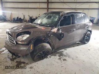 2015 MINI Countryman with VIN WMWZB3C52FWR44105, listed as a Copart auction lot 86780484 with Not Provided miles and Salvage Title. Bid and sale history available at DreamBid. Image 1.